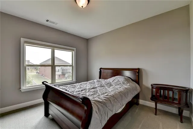 an aerial view of a house with a swimming pool and outdoor seating