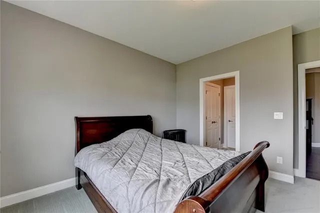 an aerial view of a house with swimming pool and patio