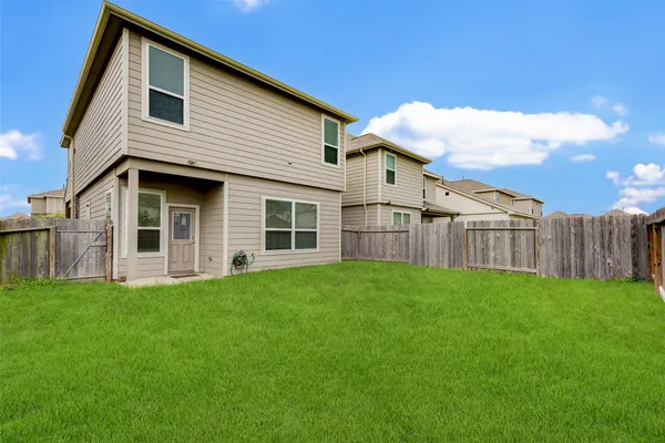 a view of a backyard of the house
