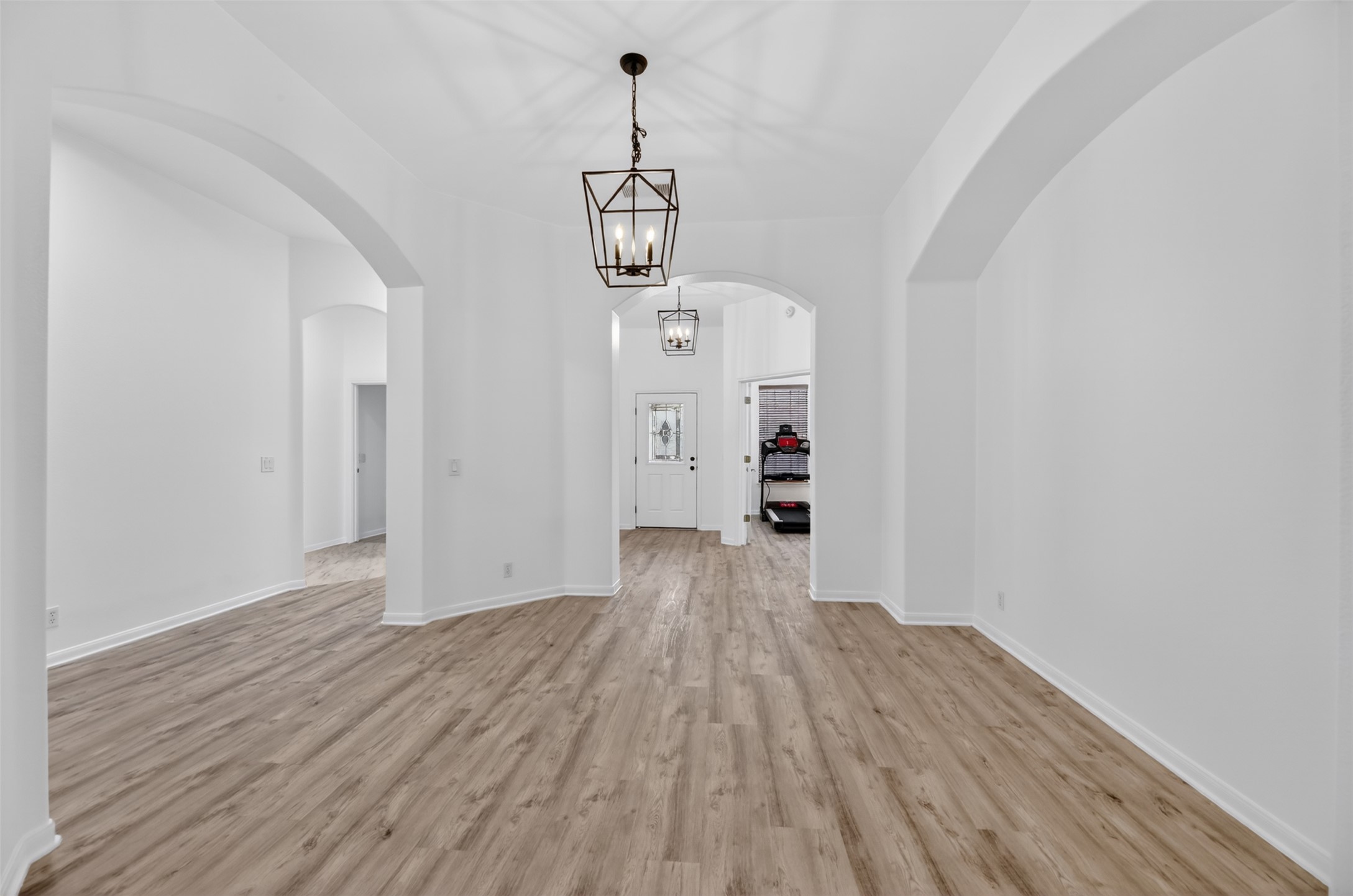 545 Manchester Lane Austin, TX 78737 - Photo 7 of 30 a view of a room with wooden floor and staircase