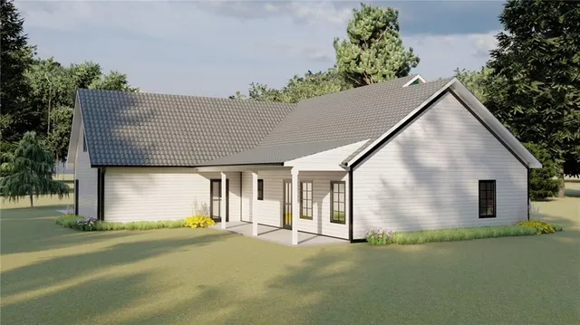 a front view of a house with a garden and garage