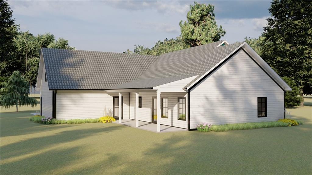 0 Fern Lane Lula, GA 30554 - Photo 2 of 14 a front view of a house with a garden and garage