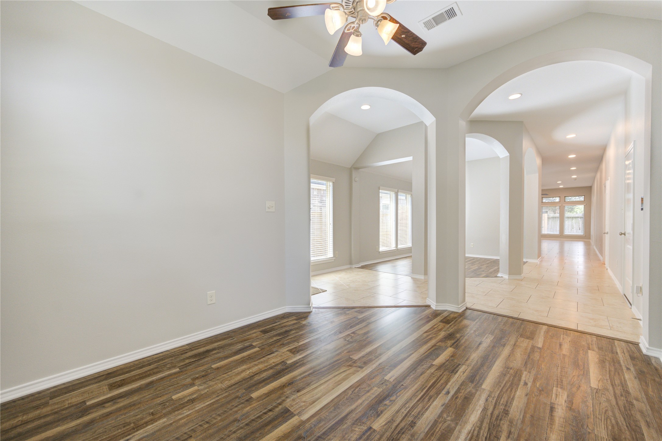 27407 Gatlin Lane Spring, TX 77386 - Photo 9 of 35 Designed with versatility in mind, this spacious area offers endless possibilities to fit your lifestyle. Whether you envision an elegant dining room, dedicated home office, playroom, or additional sitting area, the open layout and architectural details provide the flexibility to make it your own while maintaining a seamless flow throughout the home.