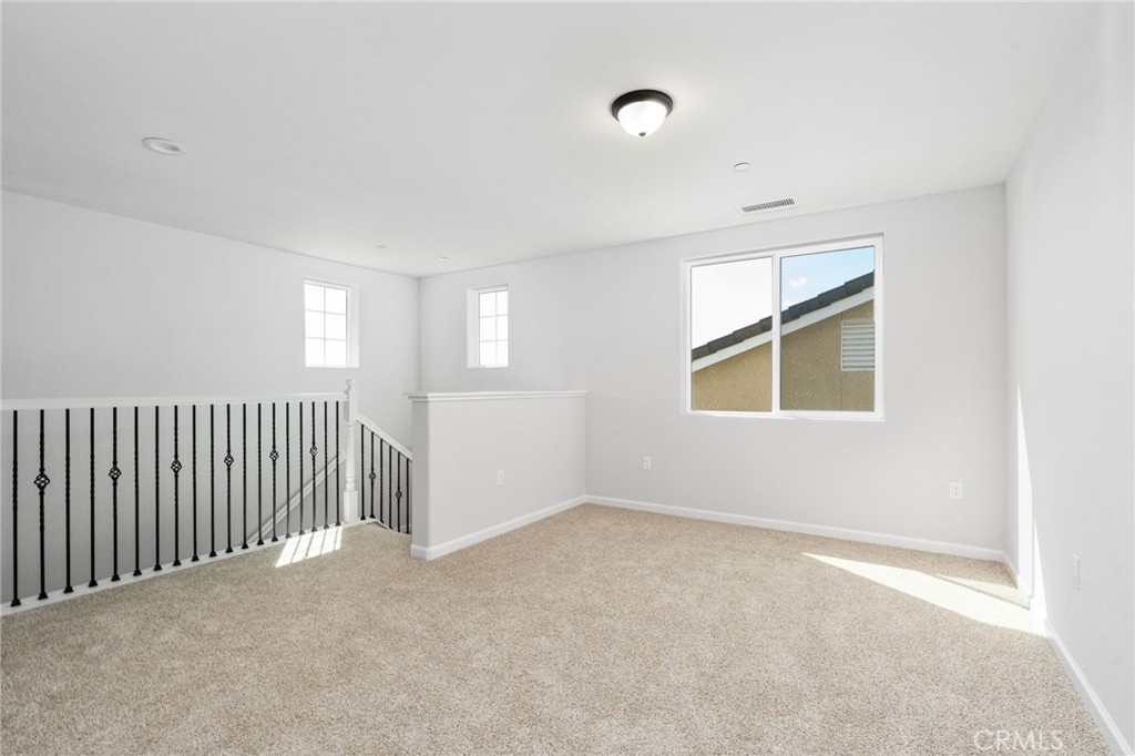1266 Talus Way South Madera, CA 93636 - Photo 25 of 43 an empty room with windows