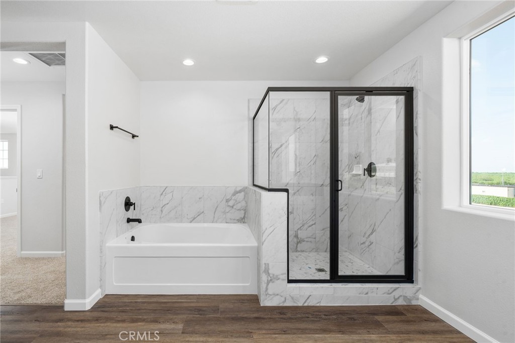 1266 Talus Way South Madera, CA 93636 - Photo 30 of 43 a bathroom with a bathtub and a shower