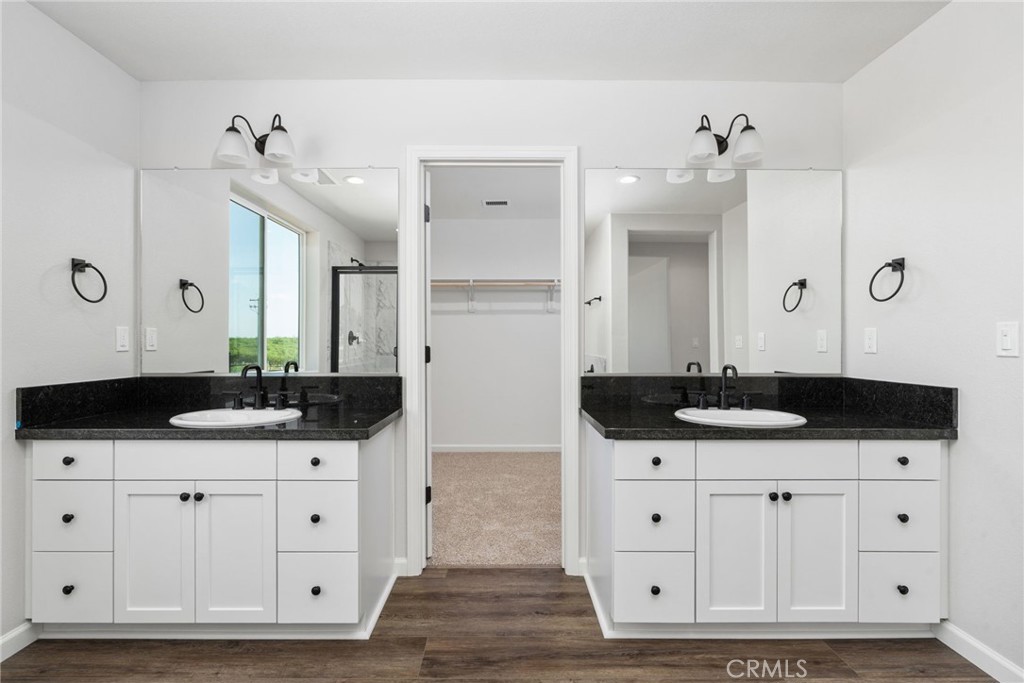 1266 Talus Way South Madera, CA 93636 - Photo 31 of 43 a bathroom with a sink and a mirror