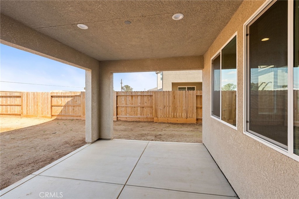 1266 Talus Way South Madera, CA 93636 - Photo 37 of 43 a view of a hallway with wooden floor and windows