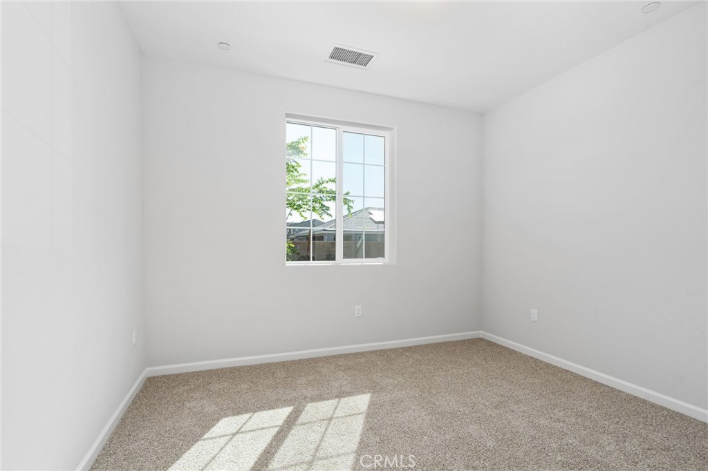 1266 Talus Way South Madera, CA 93636 - Photo 5 of 43 an empty room with a window