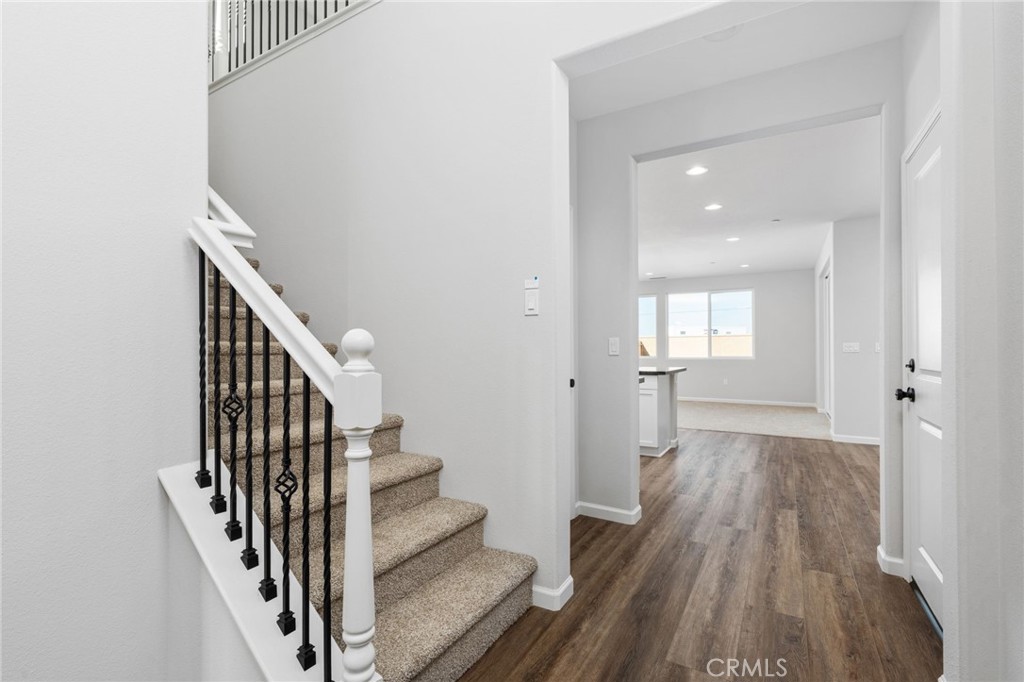 1266 Talus Way South Madera, CA 93636 - Photo 7 of 43 a view of a hallway with wooden floor and staircase