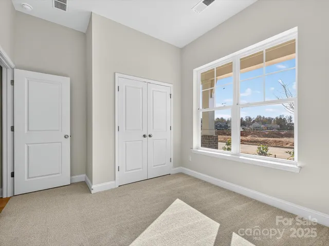 a big room with windows and closet