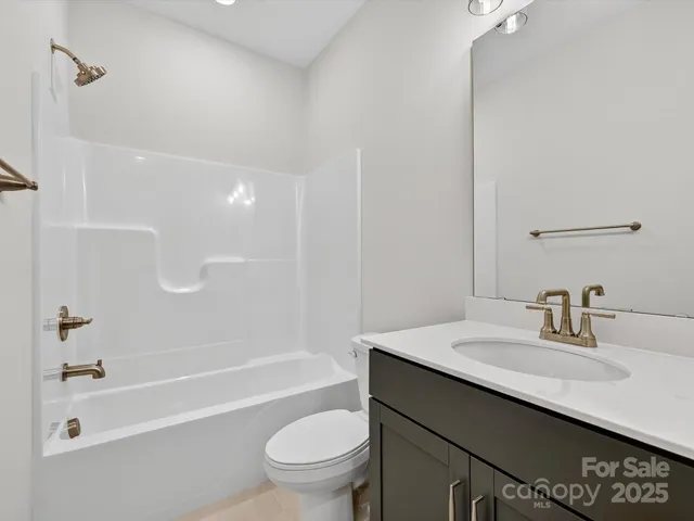 a bathroom with a sink a toilet and a bathtub