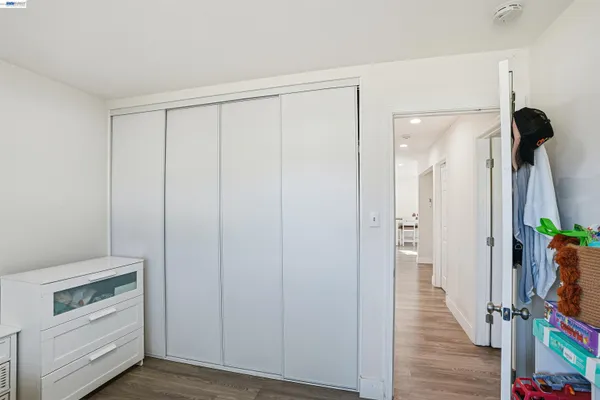 a view of an entryway with wooden floor