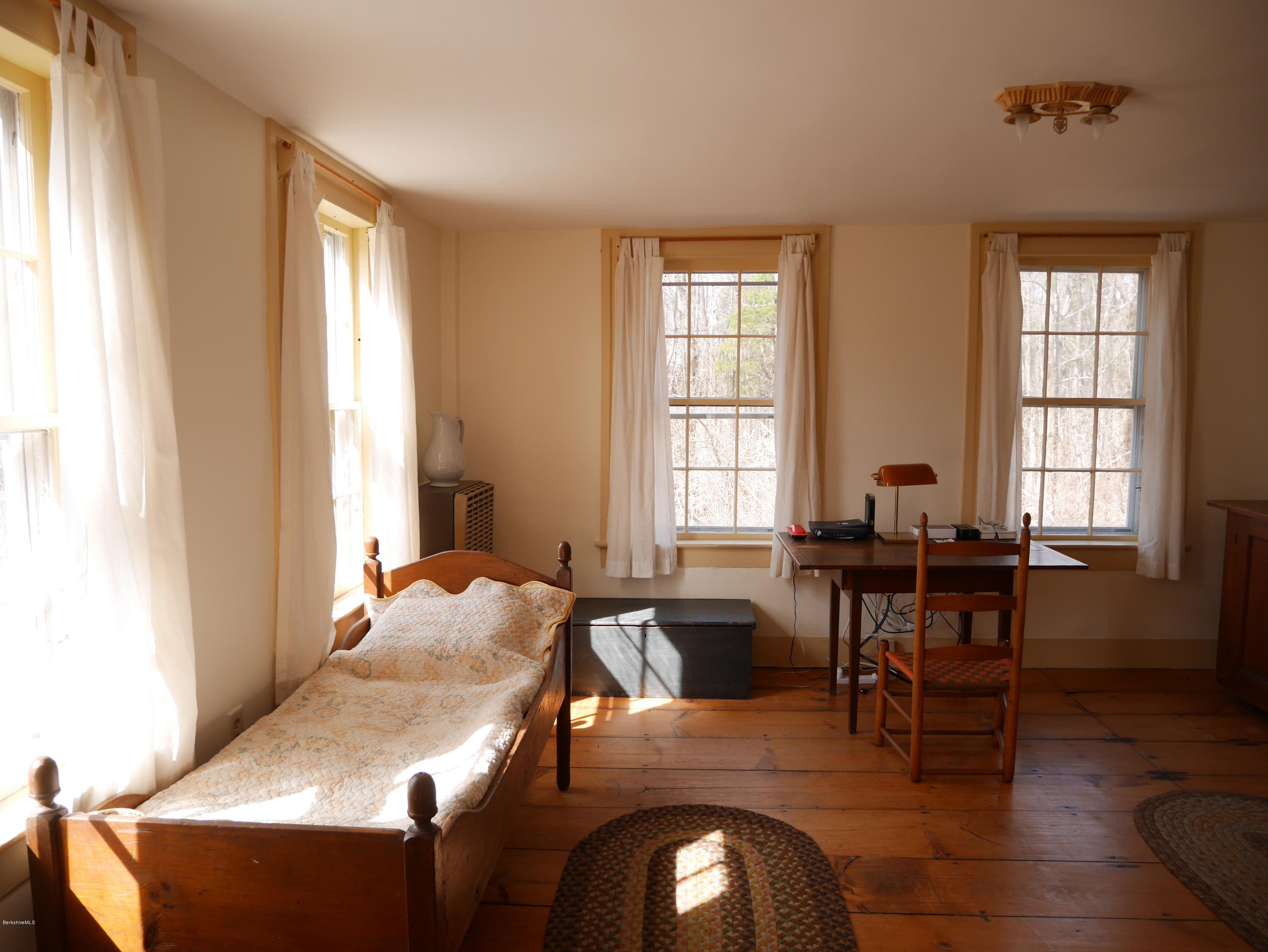 40 Cronk Road Sandisfield, MA 01255 - Photo 6 of 10 a view of a dining room with furniture and wooden floor