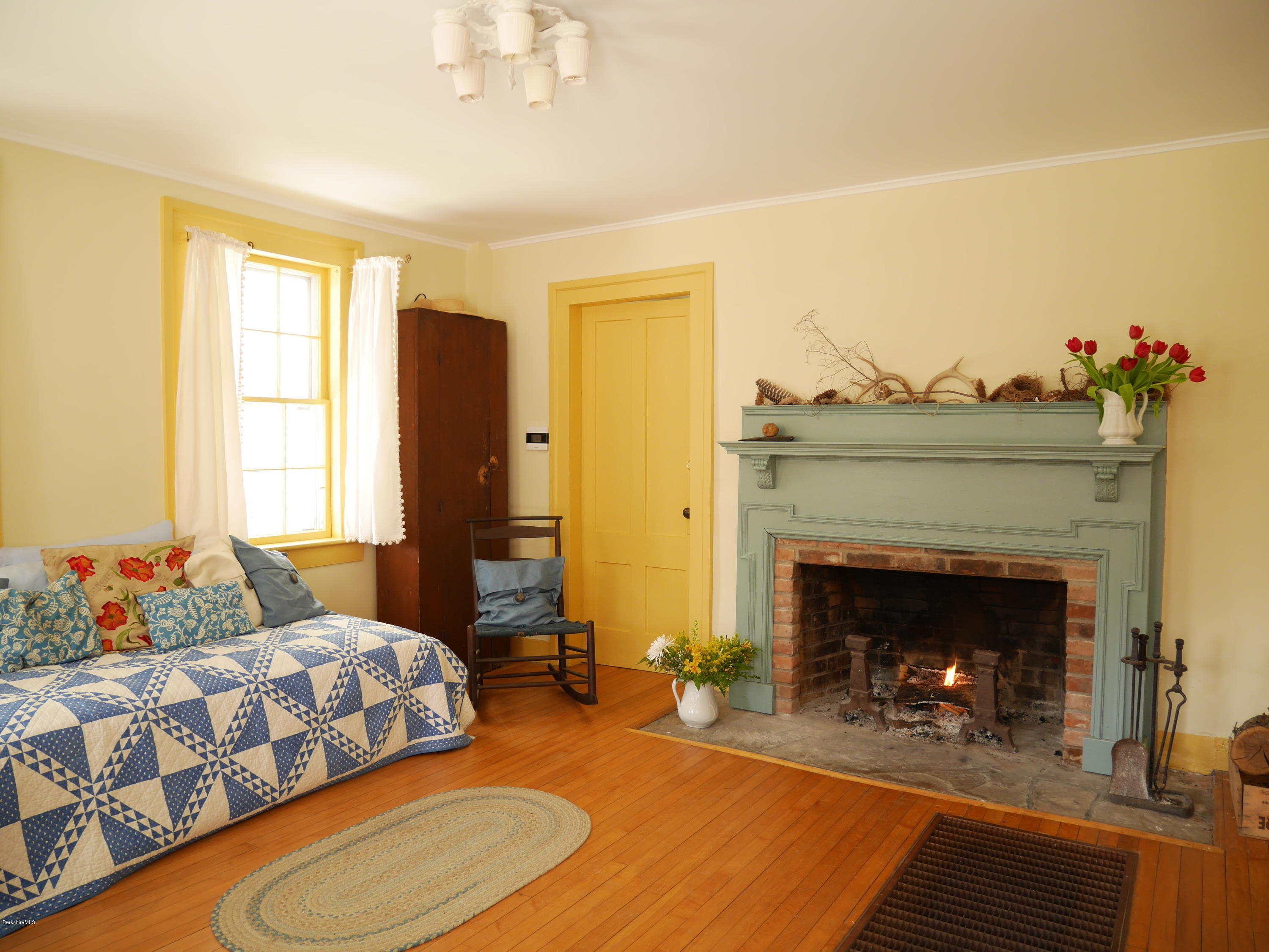 40 Cronk Road Sandisfield, MA 01255 - Photo 9 of 10 a bedroom with a bed and a fireplace