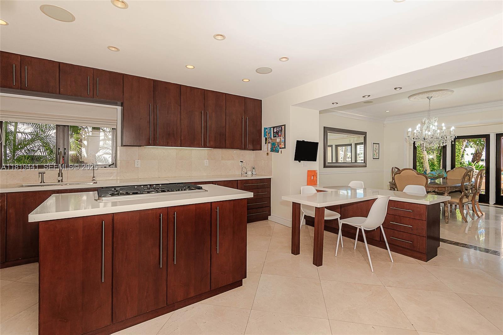 6535 Allison Road Miami Beach, FL 33141 - Photo 13 of 60 a living room with a large window and white table