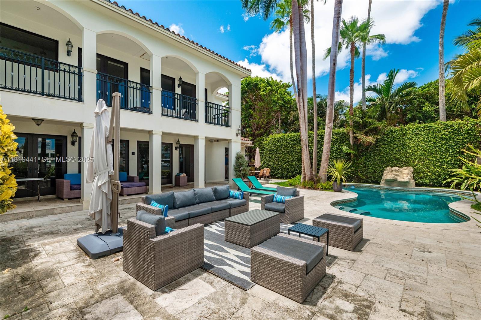 6535 Allison Road Miami Beach, FL 33141 - Photo 14 of 60 a building outdoor space with patio furniture and garden