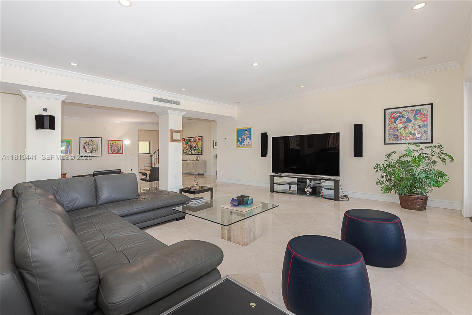 6535 Allison Road Miami Beach, FL 33141 - Photo 15 of 60 a living room with furniture and a flat screen tv