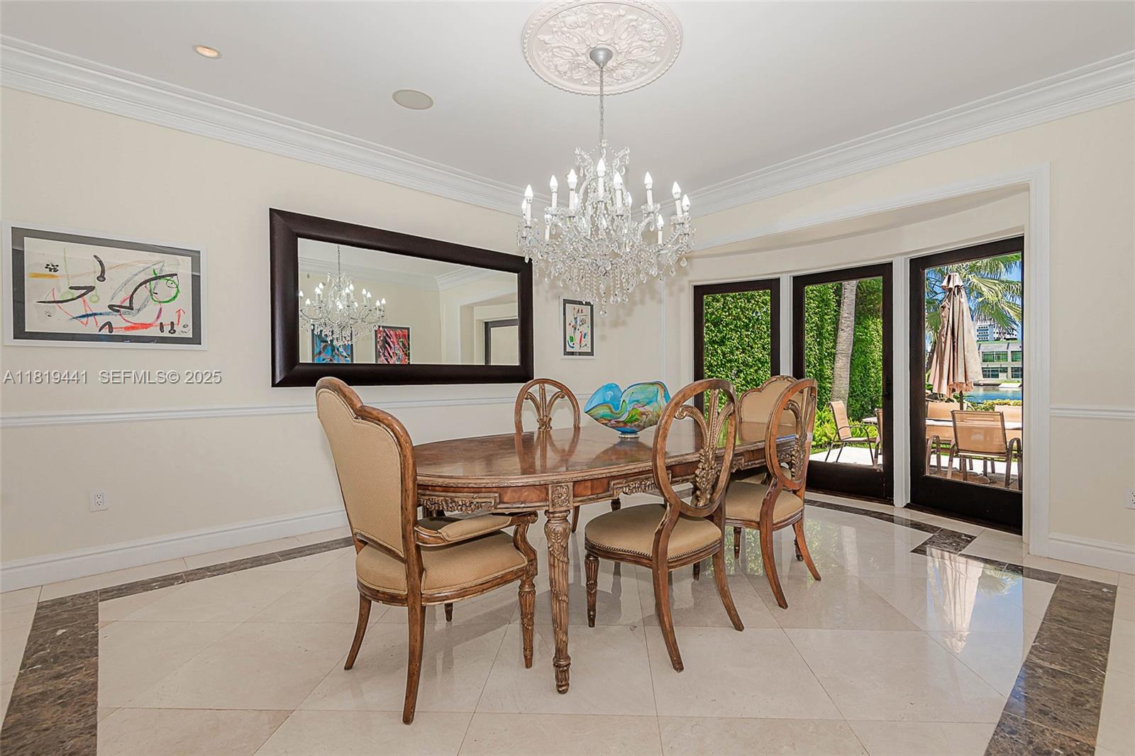 6535 Allison Road Miami Beach, FL 33141 - Photo 20 of 60 a view of a dining room with furniture window and outside view