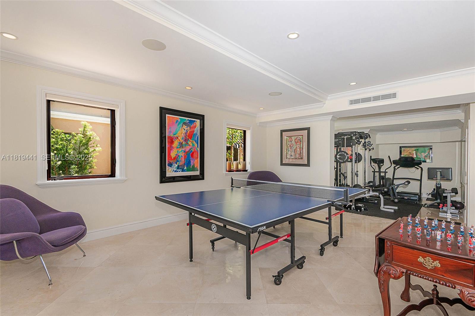6535 Allison Road Miami Beach, FL 33141 - Photo 23 of 60 a living room with furniture a rug and a window