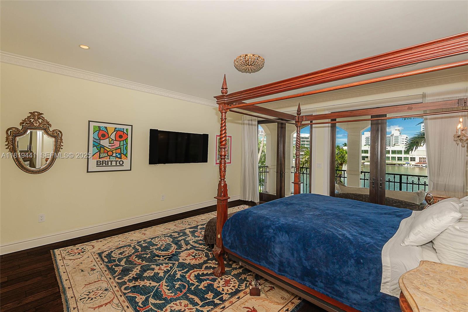 6535 Allison Road Miami Beach, FL 33141 - Photo 31 of 60 a large bed sitting in a room next to a window