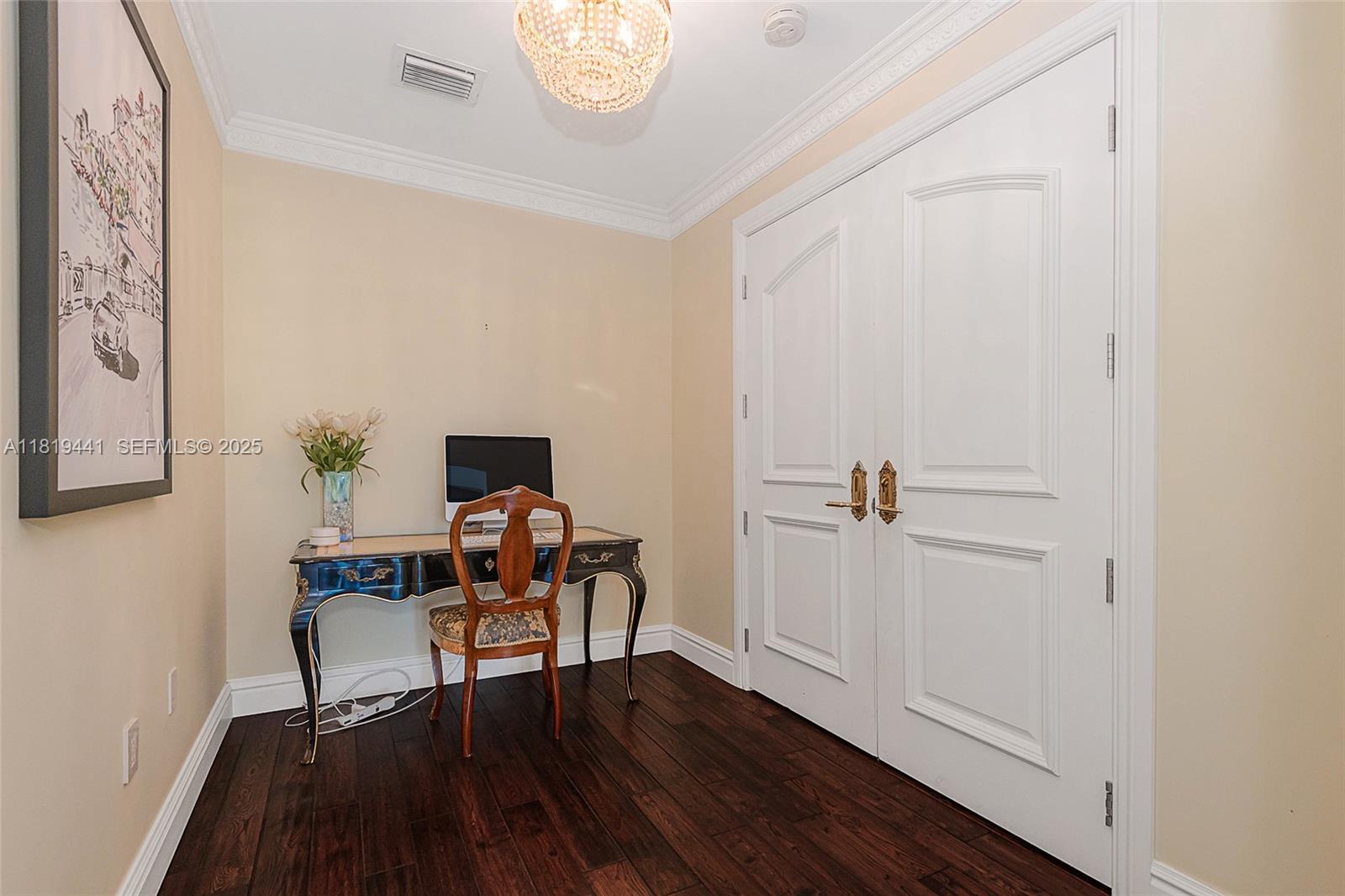 6535 Allison Road Miami Beach, FL 33141 - Photo 41 of 60 a workspace room with furniture and wooden floor