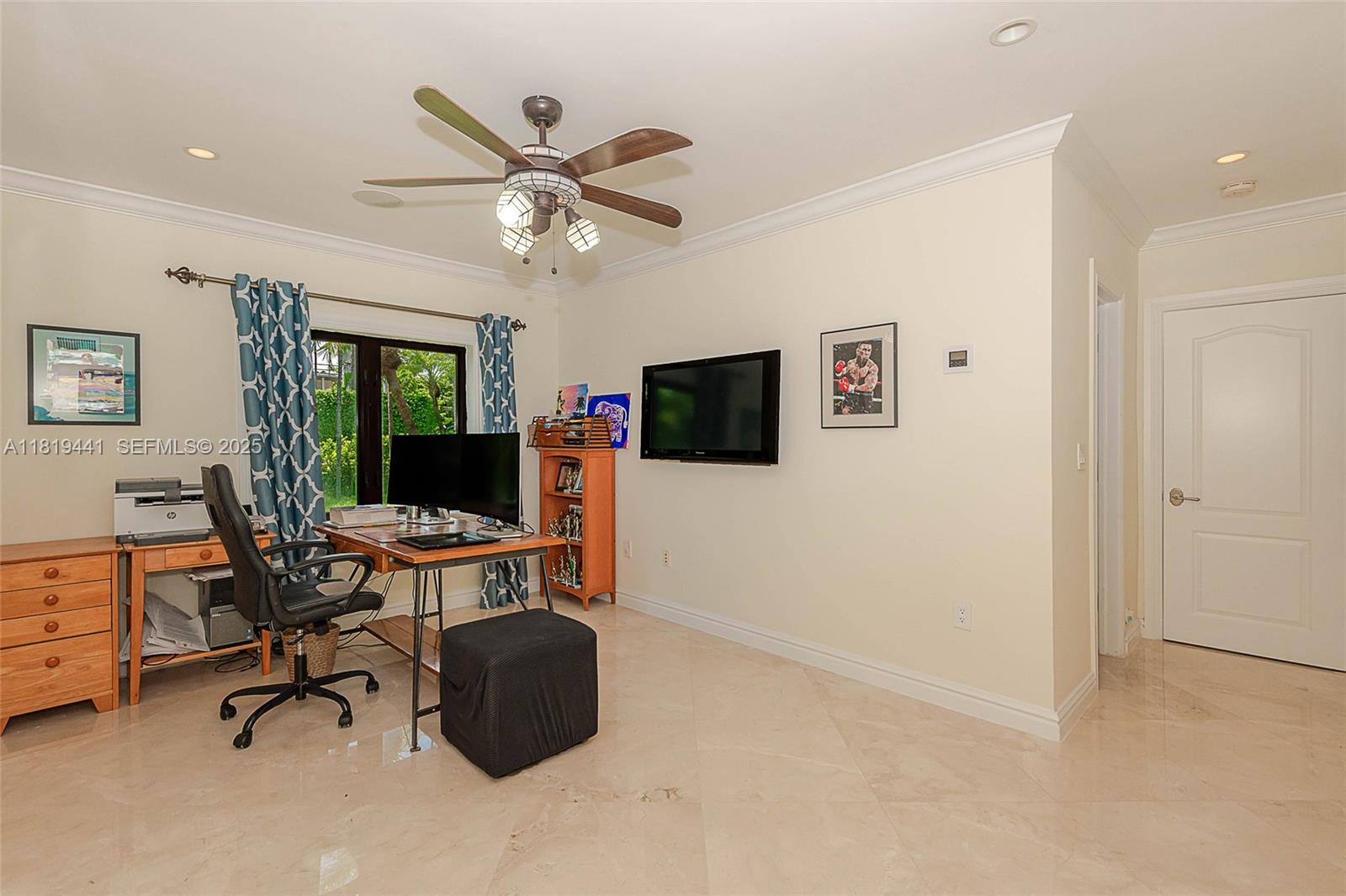 6535 Allison Road Miami Beach, FL 33141 - Photo 46 of 60 a view of a livingroom with workspace and a window