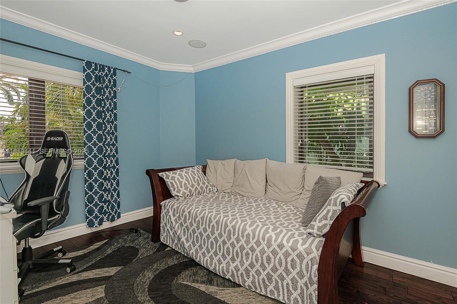 6535 Allison Road Miami Beach, FL 33141 - Photo 47 of 60 a bed sitting in a room next to a window