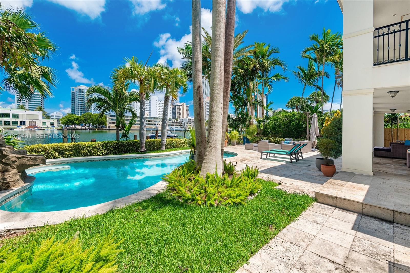 6535 Allison Road Miami Beach, FL 33141 - Photo 50 of 60 a view of a swimming pool with a patio