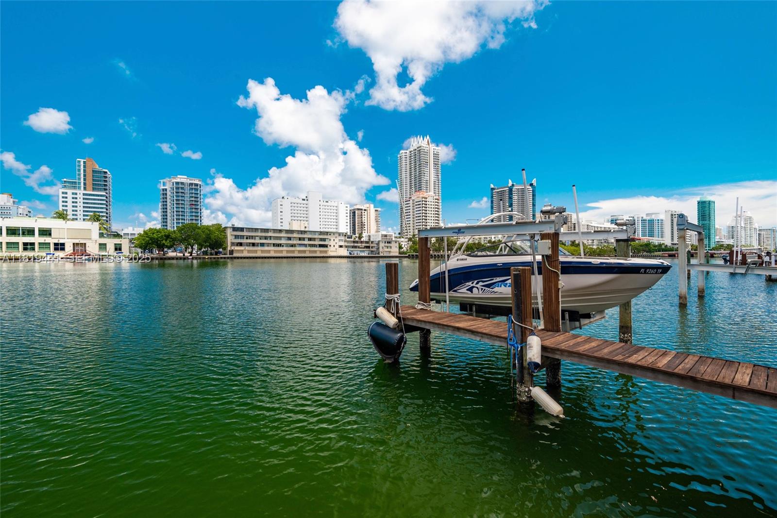 6535 Allison Road Miami Beach, FL 33141 - Photo 56 of 60 a view of a lake with a terrace