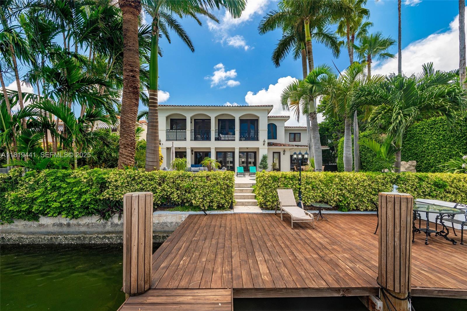 6535 Allison Road Miami Beach, FL 33141 - Photo 57 of 60 a view of house with outdoor space and sitting area