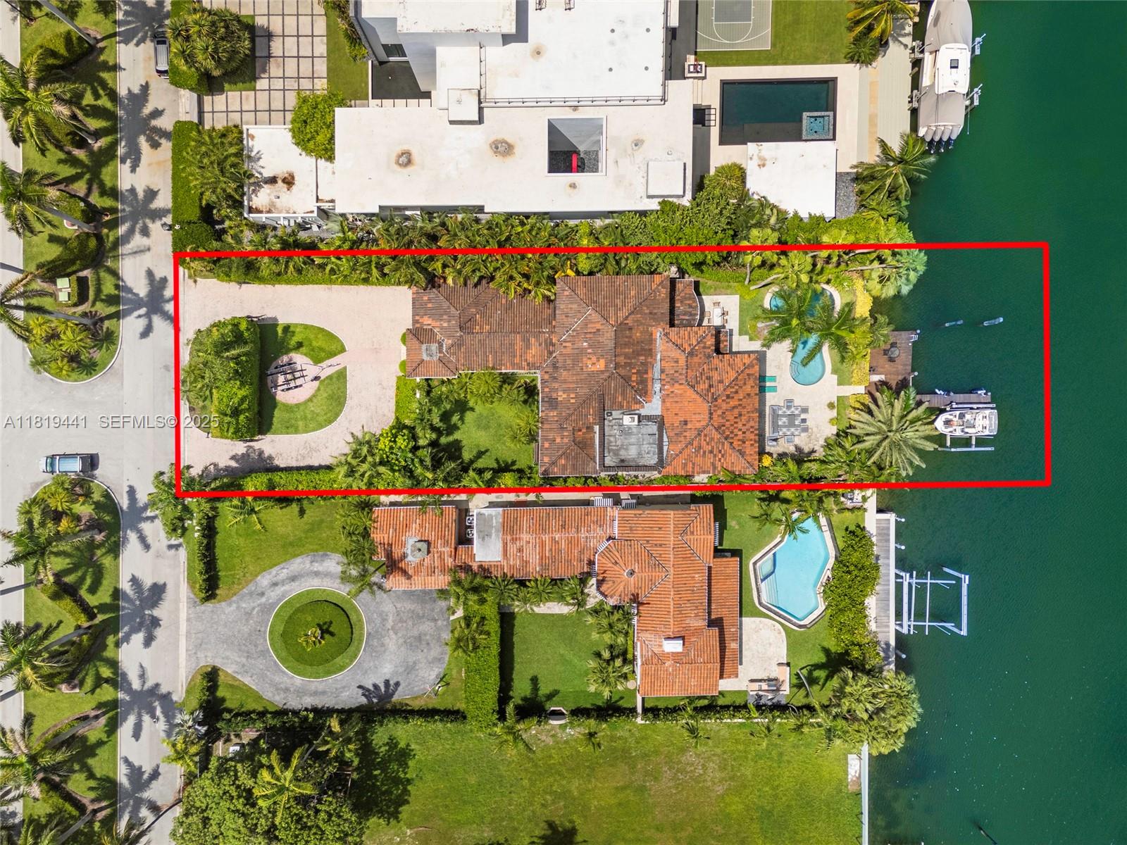 6535 Allison Road Miami Beach, FL 33141 - Photo 6 of 60 an aerial view of a house with swimming pool outdoor seating and yard