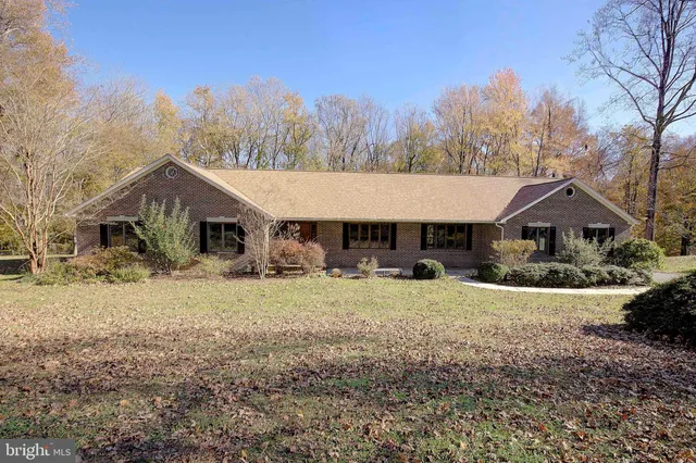 a bathroom with a toilet a sink and tub