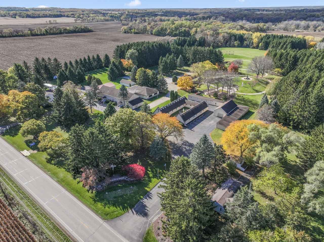 10330 336th Avenue Randall, WI 53181 - Photo 2 of 29 an aerial view of a house with a lake view