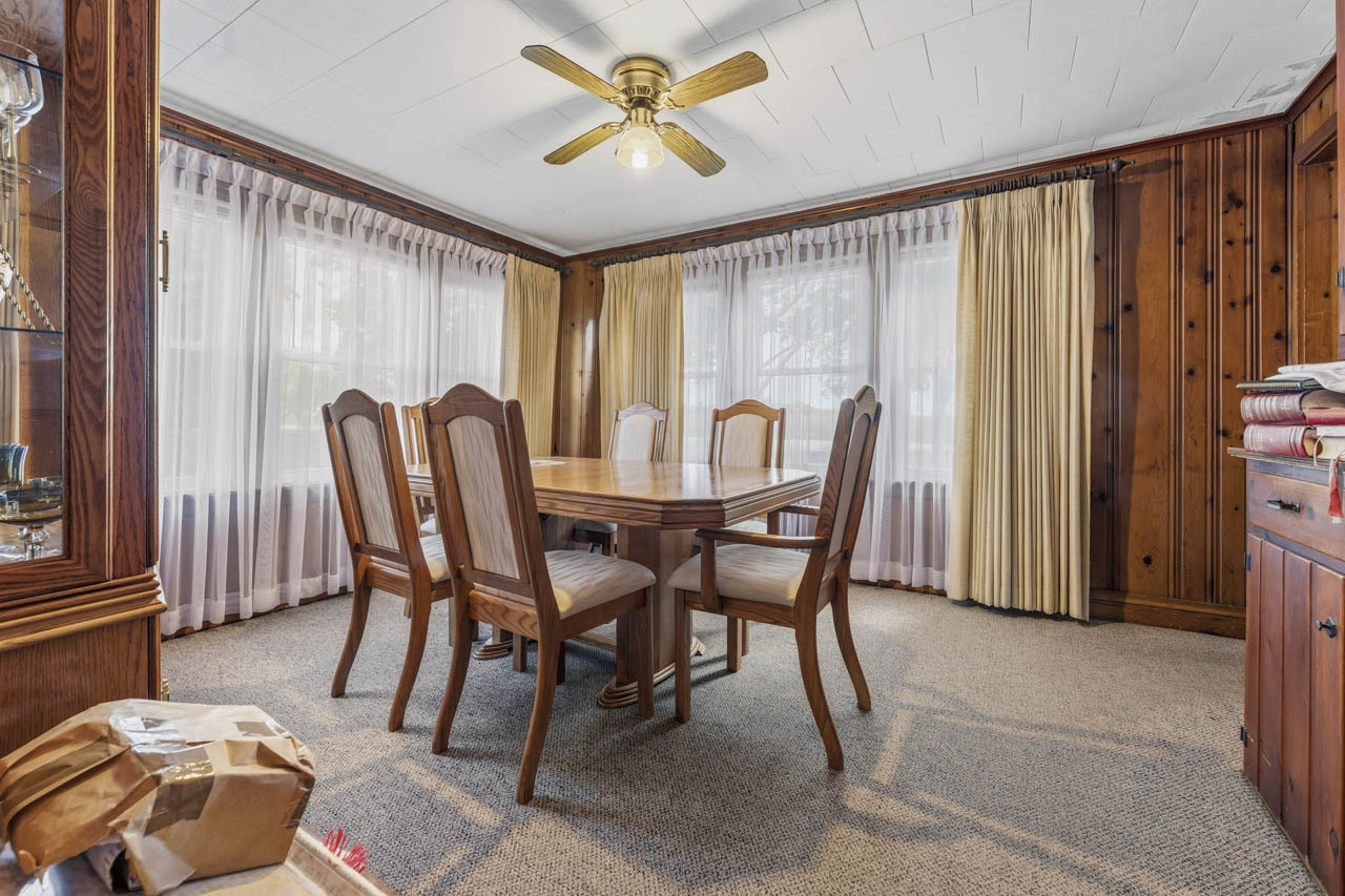 10330 336th Avenue Randall, WI 53181 - Photo 7 of 29 a view of a dining room with furniture and a window