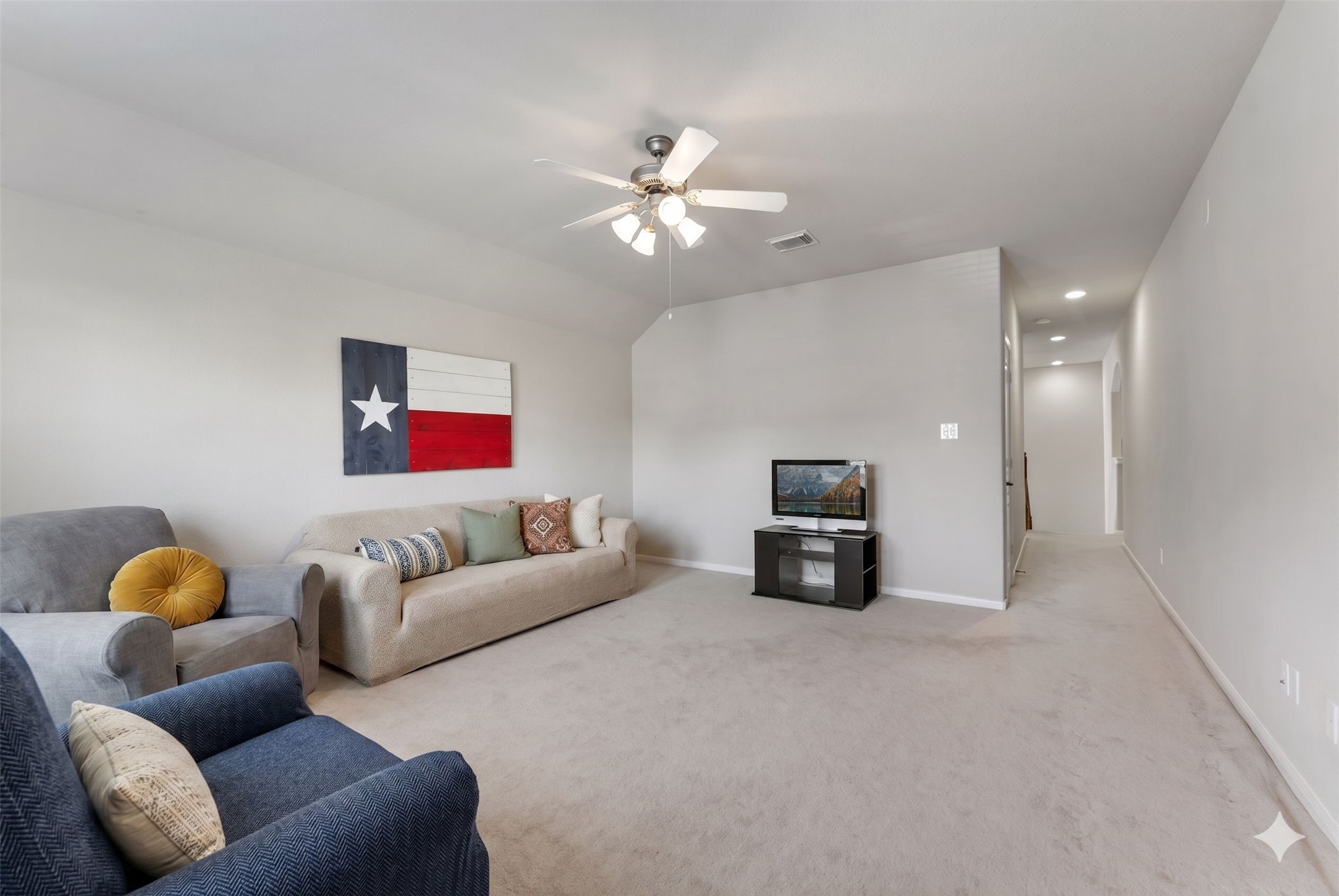 19223 Senterra Lakes Boulevard Spring, TX 77379 - Photo 29 of 48 a living room with furniture and a chandelier
