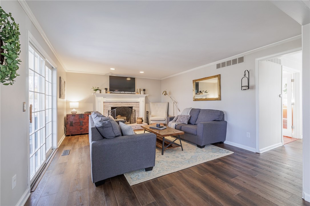 693 Audley End Webster, NY 14580 - Photo 3 of 41 FAMILY ROOM WITH FIREPLACE OPEN TO THE KITCHEN
