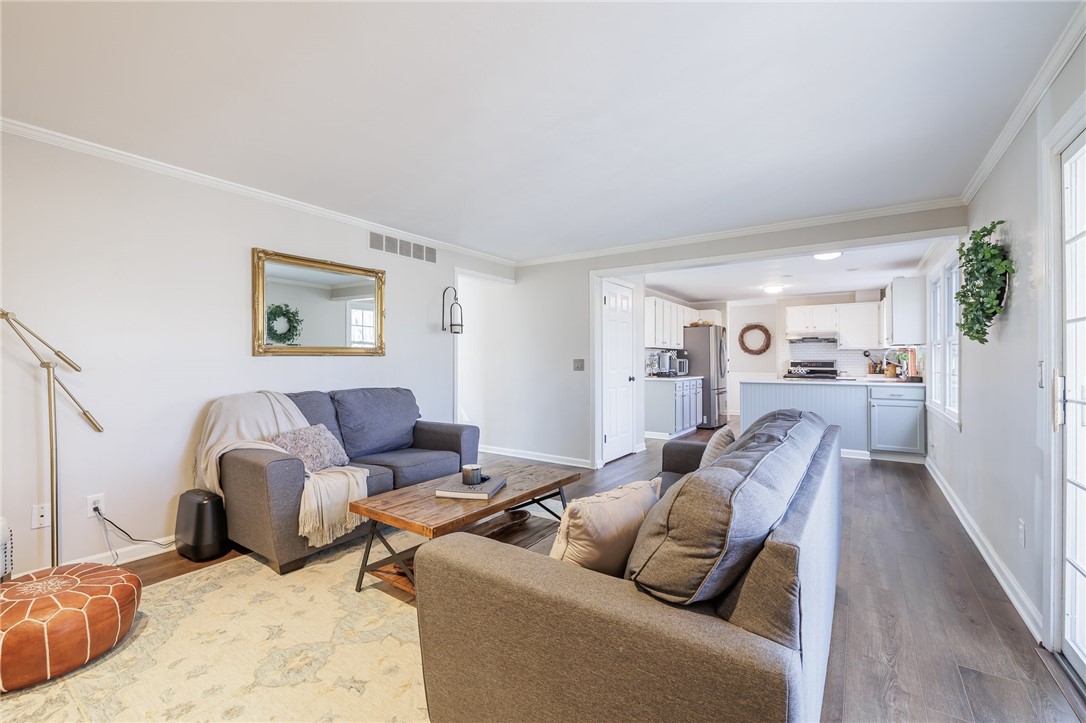 693 Audley End Webster, NY 14580 - Photo 4 of 41 FAMILY ROOM WITH FIREPLACE OPEN TO THE KITCHEN
