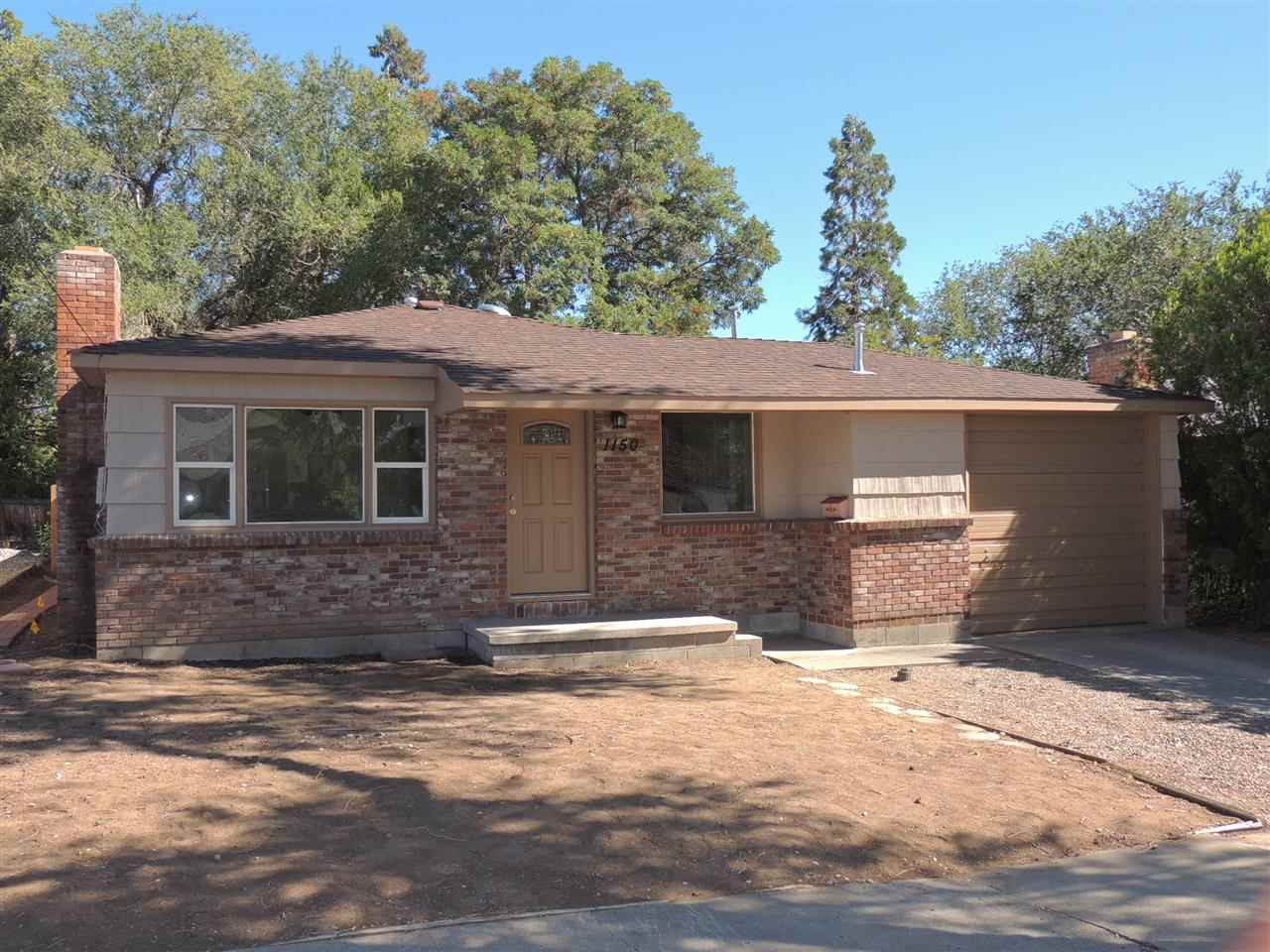 1150 Ralston Street Reno, NV 89503 - Photo 1 of 1 a front view of a house with a yard and garage
