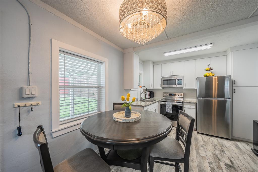 14064 Rucker Street Azle, TX 76020 - Photo 11 of 40 a view of a dining room with furniture window and outside view