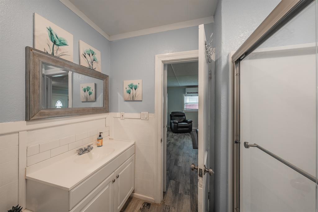 14064 Rucker Street Azle, TX 76020 - Photo 15 of 40 a bathroom with a sink and a mirror