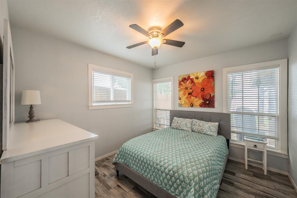 14064 Rucker Street Azle, TX 76020 - Photo 16 of 40 a bedroom with a large bed and a window