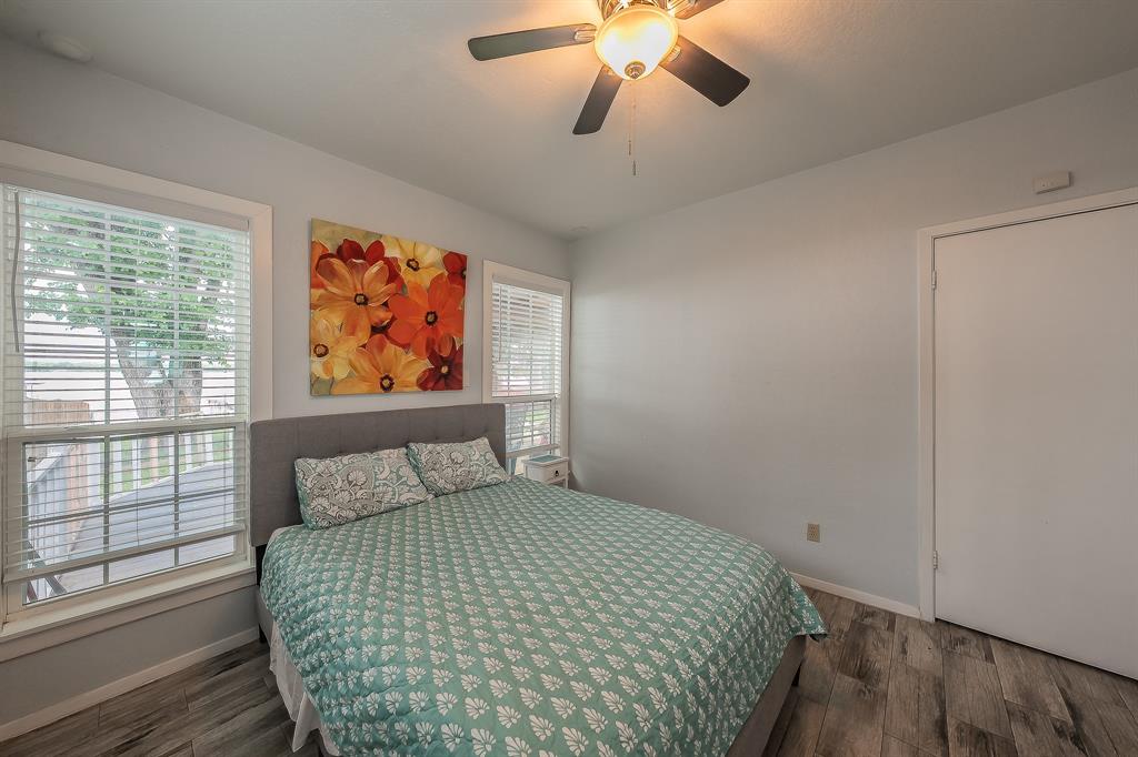 14064 Rucker Street Azle, TX 76020 - Photo 17 of 40 a bedroom with a bed and a painting on the wall