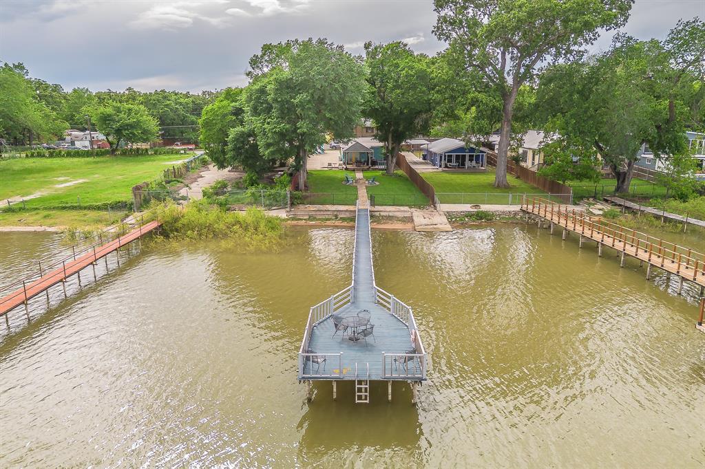 14064 Rucker Street Azle, TX 76020 - Photo 2 of 40 a view of a lake with a house swimming pool and outdoor space