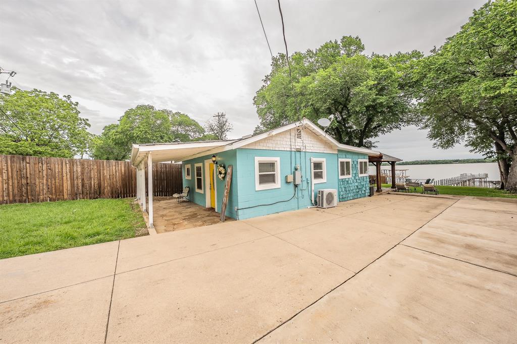 14064 Rucker Street Azle, TX 76020 - Photo 23 of 40 a front view of a house with a yard and trees