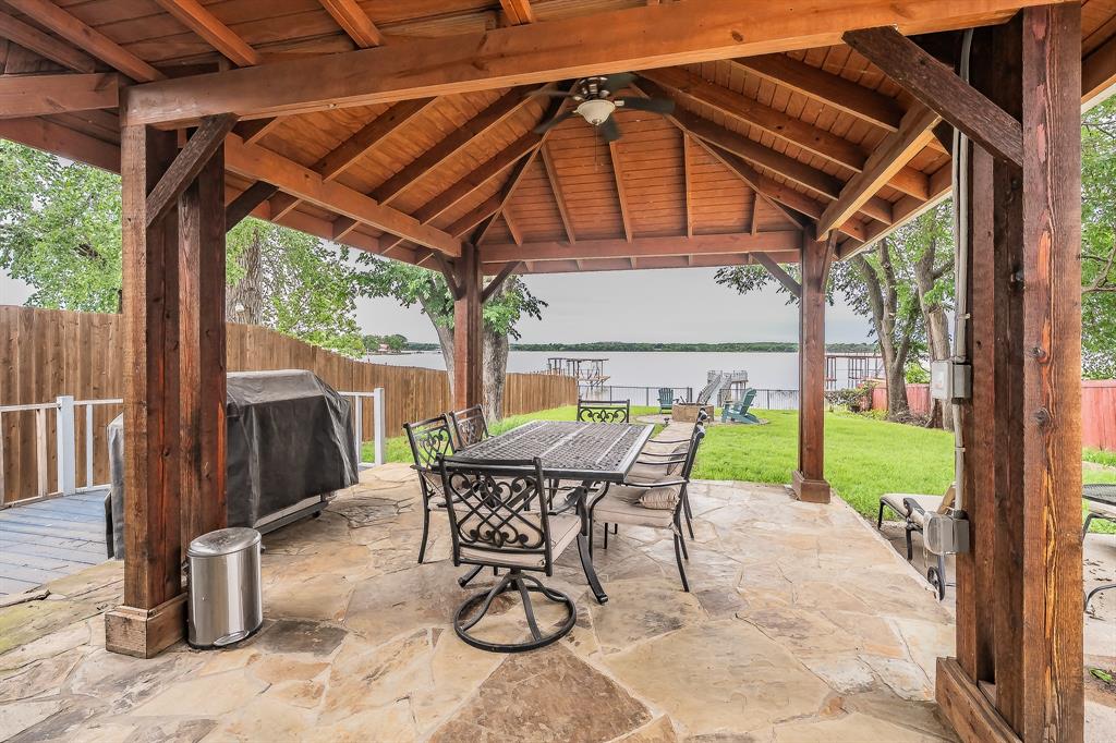 14064 Rucker Street Azle, TX 76020 - Photo 26 of 40 a patio with glass top table and chairs