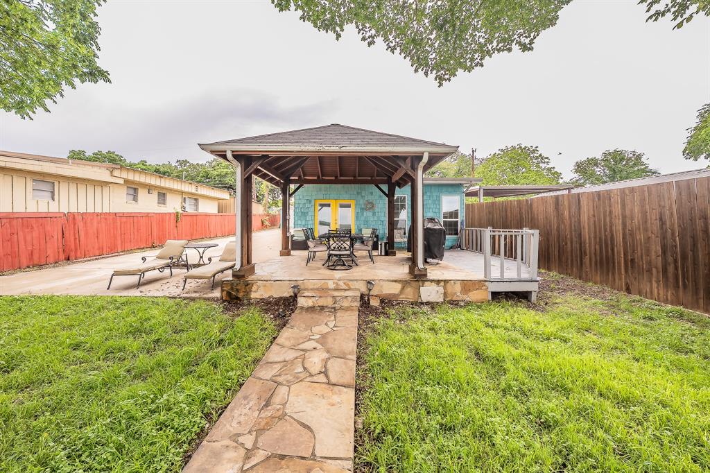 14064 Rucker Street Azle, TX 76020 - Photo 29 of 40 a backyard of a house with table and chairs