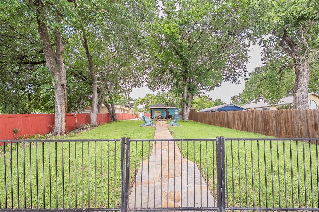 14064 Rucker Street Azle, TX 76020 - Photo 34 of 40 a view of a white house in a back yard