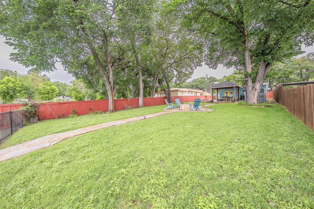 14064 Rucker Street Azle, TX 76020 - Photo 35 of 40 a view of yard with swimming pool and trees