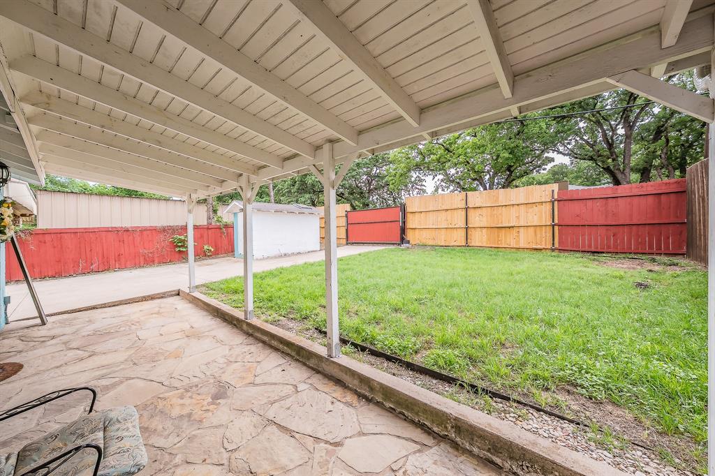 14064 Rucker Street Azle, TX 76020 - Photo 37 of 40 a view of a backyard with wooden fence