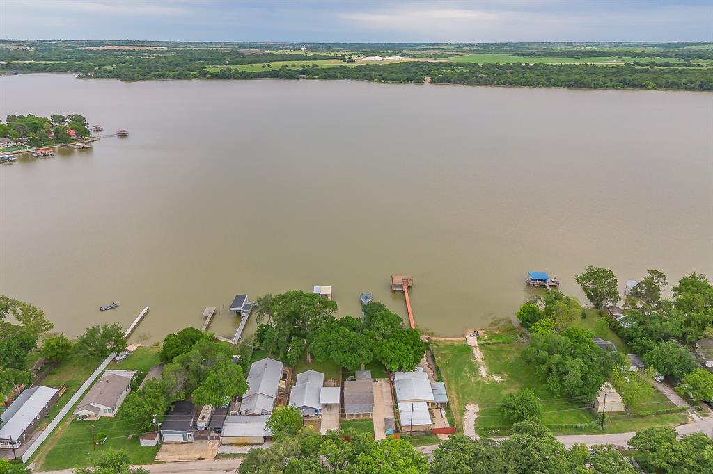 14064 Rucker Street Azle, TX 76020 - Photo 4 of 40 an aerial view of a house with a yard and a lake view